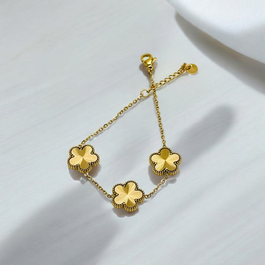 Gold-Colored Clover Bracelet with Delicate Flowers