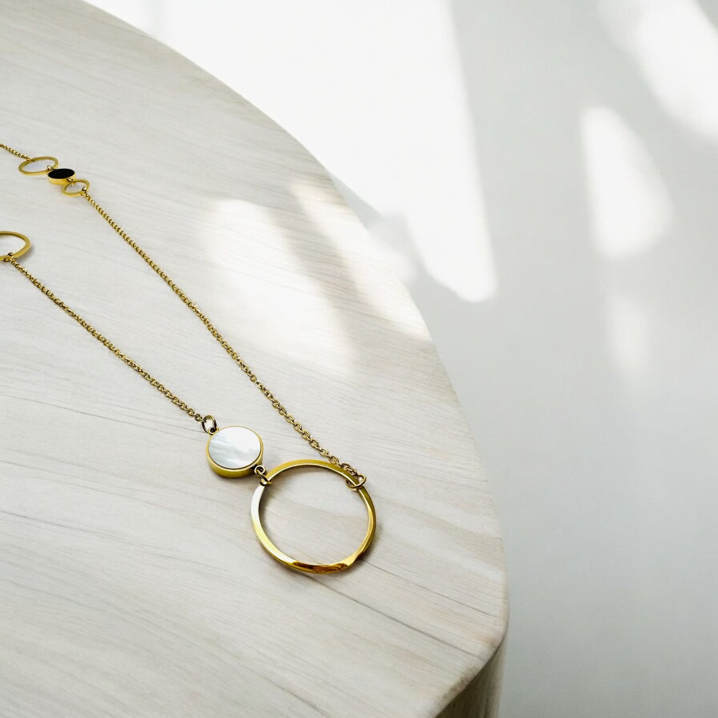 Long Gold-Colored Necklace with Circle and Mother of Pearl Pendant